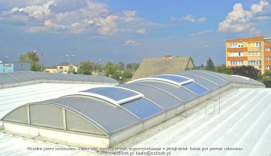 Installation of polycarbonate rooflights across the roof ridge